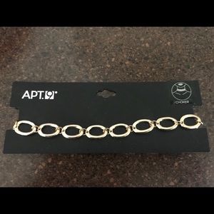 New gold tone choker.